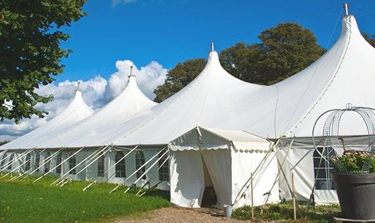 a group of luxury portable restrooms with individual stalls and running water in Hempstead